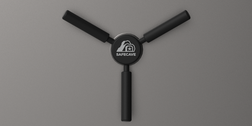 Close-up of the single-action opening mechanism on a SafeCave vault door, engaging multiple steel slide bolts.